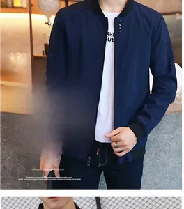 Detail of navy blue jacket featuring large functional pockets for mobile phones