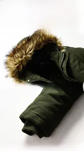 Detailed view of the winter parka featuring a faux fur collar and windproof ribbed cuffs