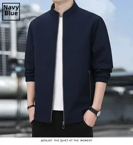Detailed view of dark blue business jacket featuring stand collar and metal zipper