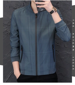 Close-up of men's navy blue jacket featuring subtle grid texture and ribbed cuffs