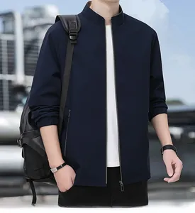 Detail of navy blue business jacket showing ribbed cuffs, side pocket and zipper closure
