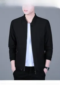 Close-up of black men's windbreaker jacket featuring ribbed cuffs and a stand collar design