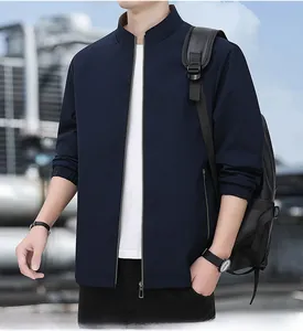 Close-up of a dark blue men business jacket featuring a stand collar and metal zipper