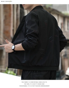 Close-up of black baseball collar jacket with red and grey scratched pattern fabric