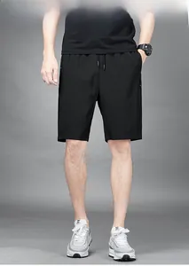Detailed view of men's quick-dry sports shorts with elastic waist and zipper pockets