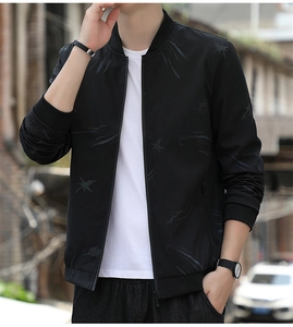Detail of black baseball collar jacket with grey star patterns and ribbed cuffs