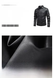 Detailed macro view of high-quality faux leather texture on black motor biker jacket