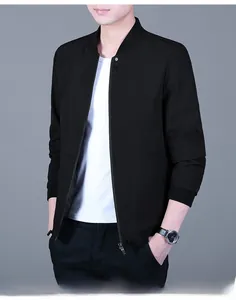 Detail of classic black bomber jacket featuring ribbed collar and smooth zipper closure