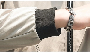 Detail of vintage silver Cuban link bracelet with engraved spring clasp on a male wrist
