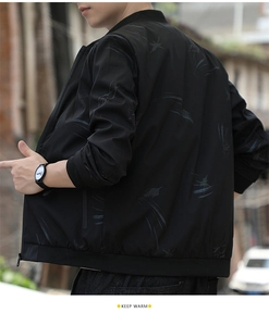 Detail of black bomber jacket with dark grey feather pattern and ribbed stand collar