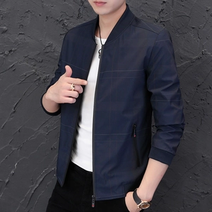 Detailed close-up of dark blue plaid jacket featuring standing collar and metal zipper