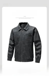 Close-up of black matte faux leather jacket with metal button chest pockets and rib cuffs