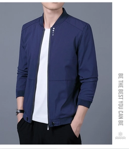 Detailed view of navy blue windbreaker jacket with metal zip and button collar details