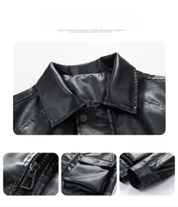 Detail of black faux leather jacket showing metal zipper, chest pockets, and button cuffs