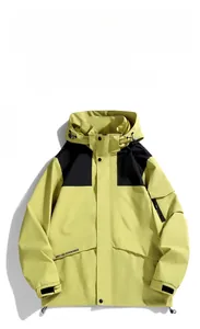 Detail of waterproof outdoor jacket featuring yellow and black contrast panels and hood