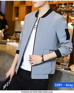 Detailed view of grey baseball jacket with black ribbed collar and utility arm pocket