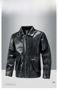 Close-up of black faux leather motorcycle jacket with snap buttons and white lettering