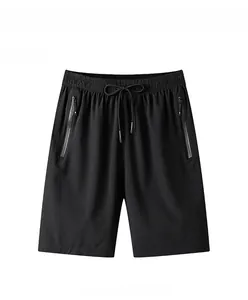 Detail view of men's quick-dry sports shorts featuring elastic waistband and zipper pockets