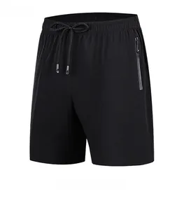 Detail view of men's quick-dry sports shorts showing elastic waistband and zip pocket