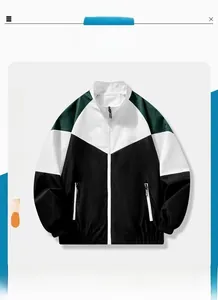 Detail of color-block jacket showing high collar, full zipper, and elastic cuffs in green