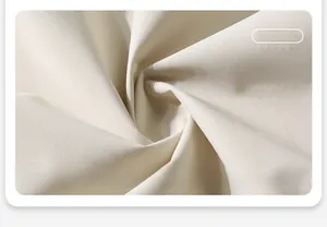 Macro detail of cream windproof and water-repellent functional fabric for outdoor jackets