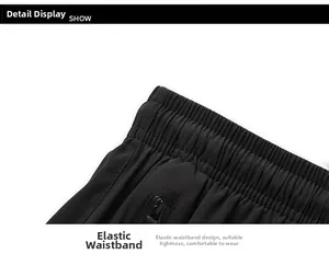 Close-up of elastic waistband with detailed stitching and zipper pocket on quick-dry shorts