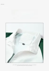 Detail of white and green sporty jacket with stand collar and mesh lining