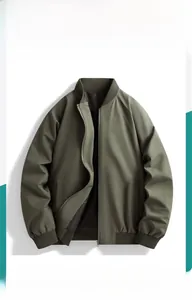 Detail of army green bomber jacket featuring ribbed collar and metallic silver zipper