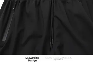 Detail of men's quick-dry shorts featuring elastic waist, drawstring and waterproof zipper