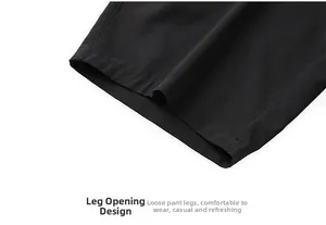 Detailed macro view of double-stitched hem on black quick-dry men's sports shorts