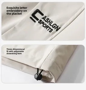 Detailed embroidery logo and adjustable drawstring hem on beige outdoor jacket