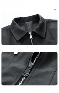Close-up of premium black leather jacket showing neck collar and silver metal zipper details