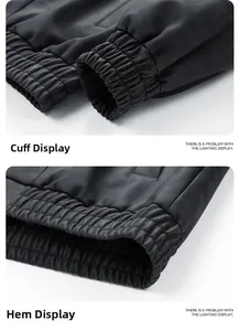 Detail of ribbed elastic cuffs and hem on a black faux leather motorcycle jacket