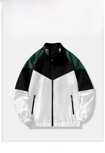 Detail of men's color-block jacket with V-shaped white black and green panels