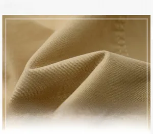 Detailed macro view of khaki eco-friendly fiber fabric with wrinkle-resistant texture