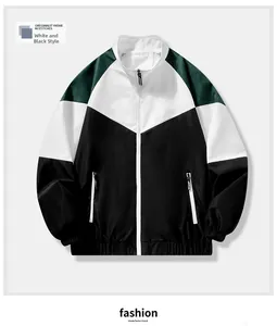 Detail of color-block windbreaker jacket featuring elastic cuffs and zippered pockets