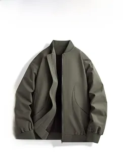 Detailed view of an olive green bomber jacket featuring ribbed cuffs and a smooth metal zipper