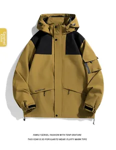 Detail of caramel and black outdoor jacket showing adjustable hood and sleeve pockets