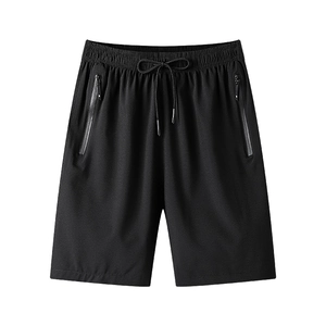 Men's black quick-dry sports shorts with elastic drawstring waist and zippered pockets