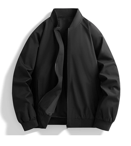 Detail of black bomber jacket featuring ribbed stand-up collar and smooth metal zipper
