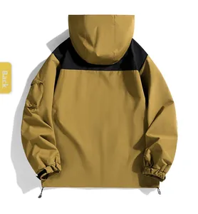 Back view of a khaki and black outdoor windbreaker with hooded design and adjustable hem