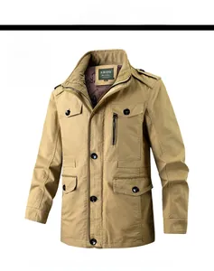 Detail view of khaki cotton work jacket featuring utility pockets and stand collar