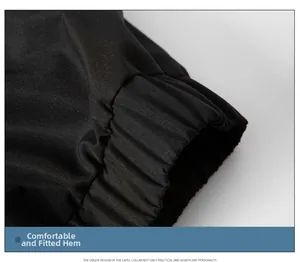 Detail of black cotton jacket featuring elastic ribbed hem with premium quilted texture