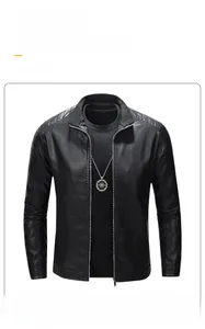 Detail of slim fit black faux leather jacket featuring stand collar and quilted shoulder patterns