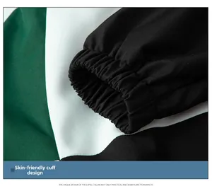 Detailed macro view of elasticated color-block cuffs in green, white, and black tones