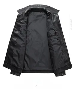 Detailed view of black leather jacket lining with stand collar and inner pocket