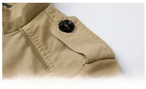 Detail of khaki cotton jacket showing epaulette design and shoulder stitching