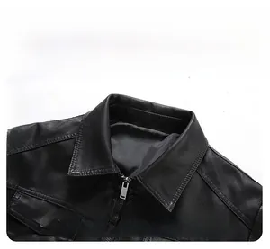 Detail view of a classic black faux leather motorcycle jacket collar with a metal zipper