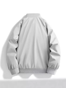 Back view of a men's light grey minimalist pilot bomber jacket with ribbed trims