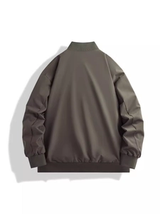 Back view of a casual loose-fit olive bomber jacket with ribbed cuffs for men and women